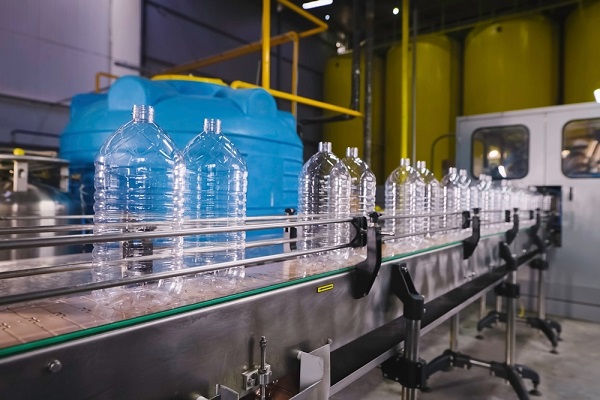 Bottles for sunflower oil on the conveyor. vegetable oil