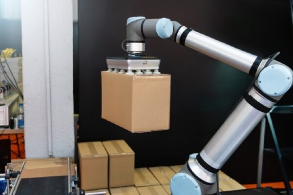 Robot arm moves box in an automatic warehouse