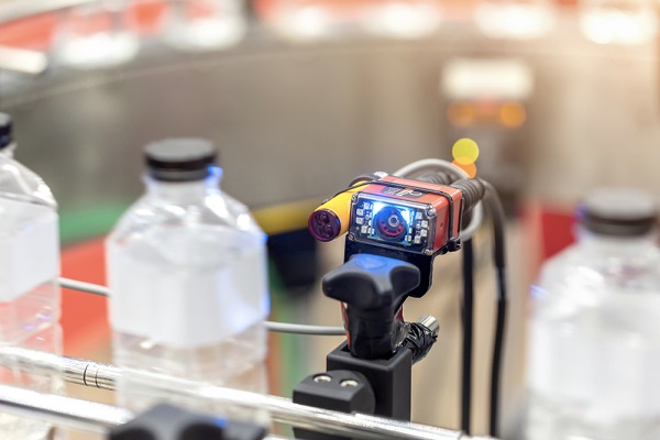 barcode reading technology for the production line of plastic bottles on a conveyor belt