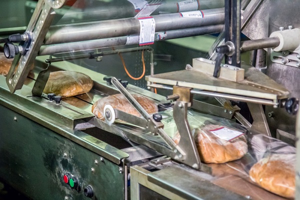 device for packing cooked bread at the factory in process