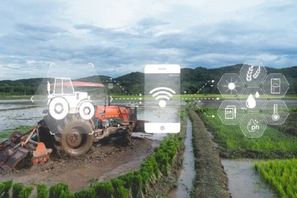 Autonomous tractor working in farm.Smart farming and digital transformation in agriculture