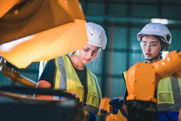 Factory engineer woman-inspecting on machine